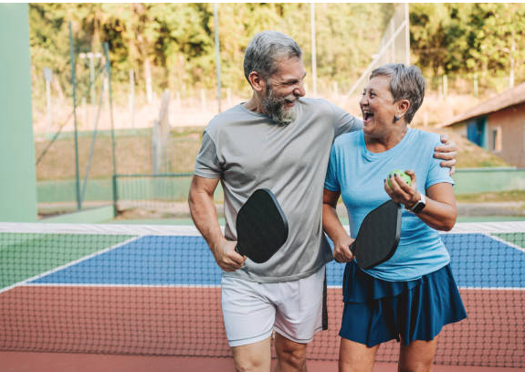 Retiree couple playing